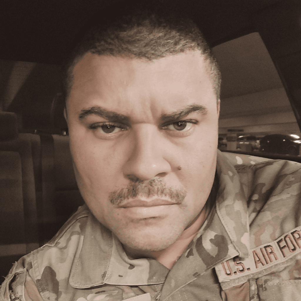 Portrait of Andre Ramone in U.S. Air Force OCP uniform, looking directly at the camera with a serious expression